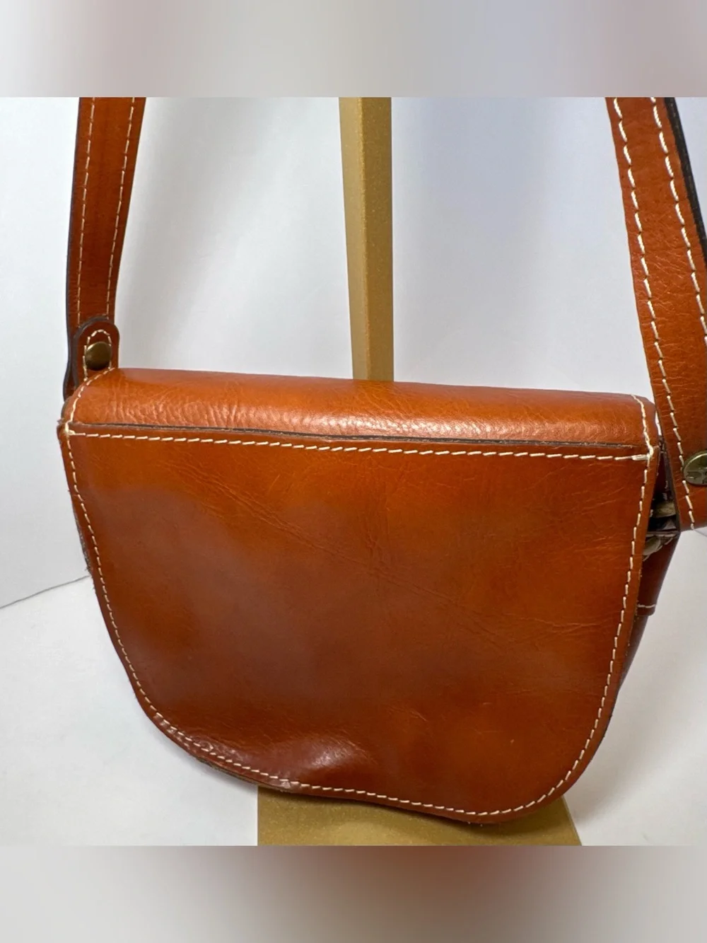 Patricia Nash Bonella Mini Crossbody Saddle Bag in their signature tan/cognac